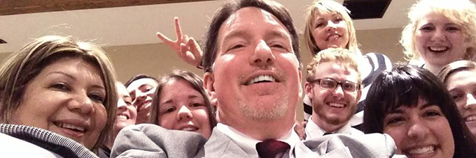 Faculty taking a selfie with students