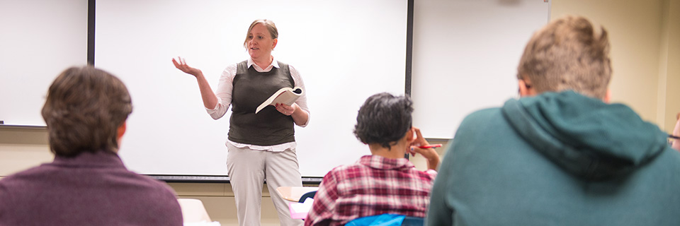 professor leading a discussion in Latin class